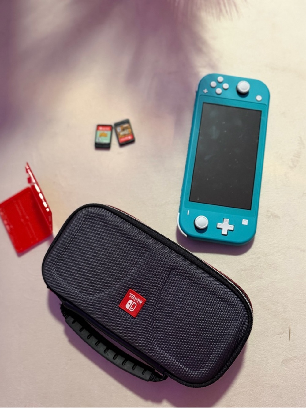 Nintendo Turquoise Handheld Console with Black Carry Case